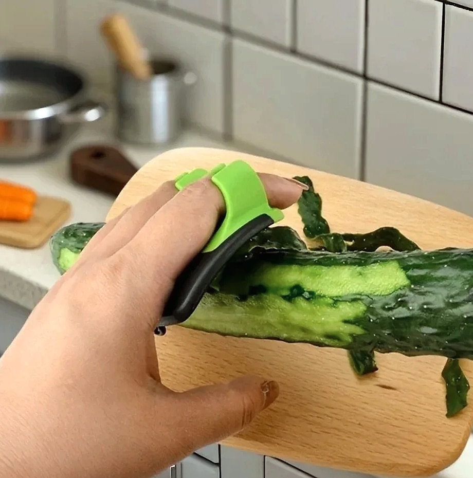 Black and Green Kitchen Peeler with Sharp Blade and Grip — side view